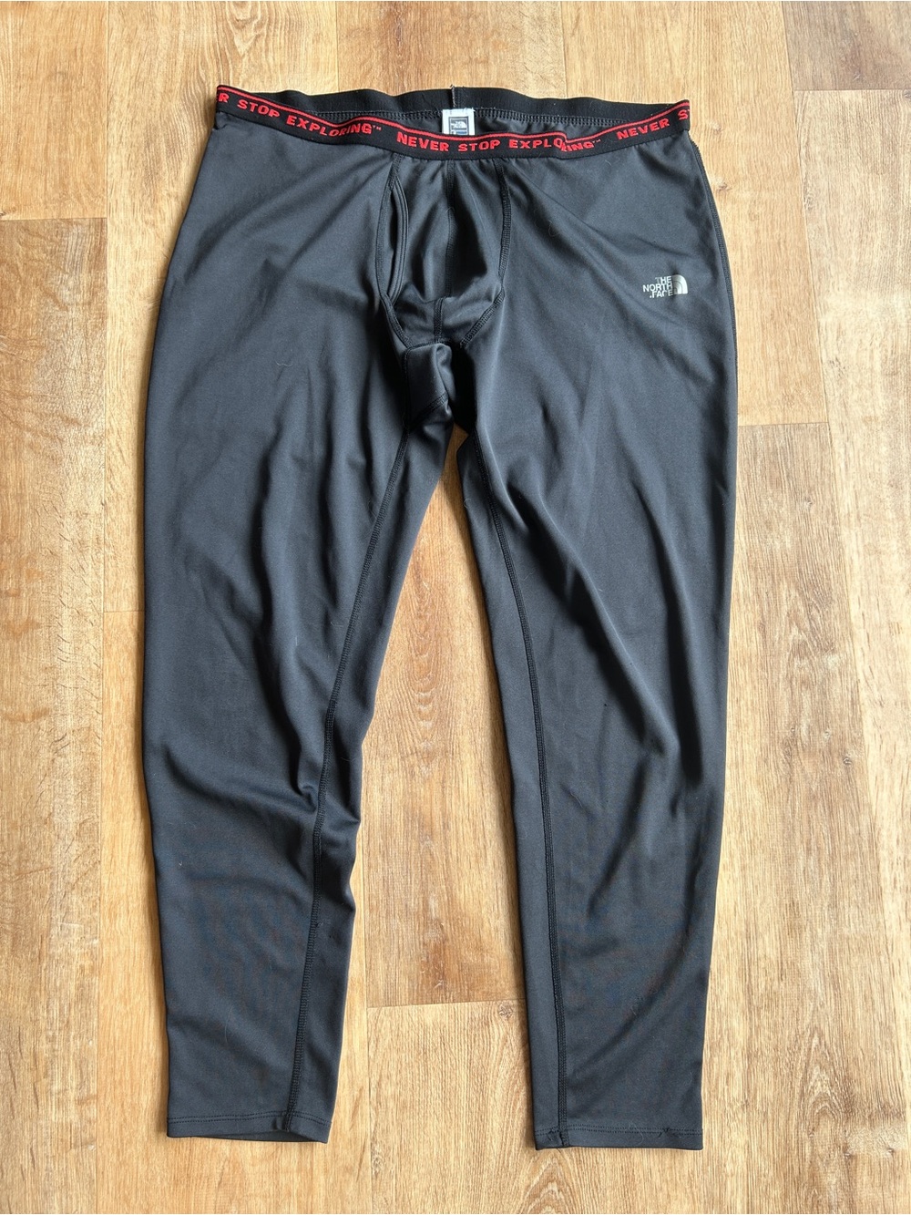 The North Face Black Men's Base Layer Pants with Red Waistband Accent